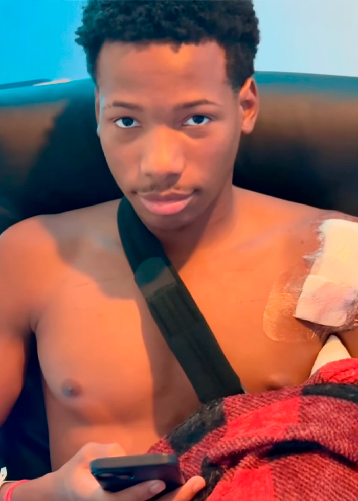 Karmelo Anthony, a young man with a bandaged shoulder and arm sling, holding a phone, as part of the Karmelo Anthony case. Karmelo Anthony, a young man with a bandaged shoulder and arm sling, holding a phone, as part of the Karmelo Anthony case.