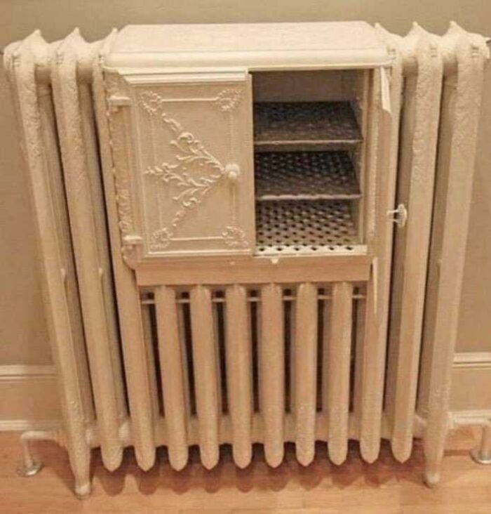A radiator with a small, ornate cabinet built into it, an example of British humor.