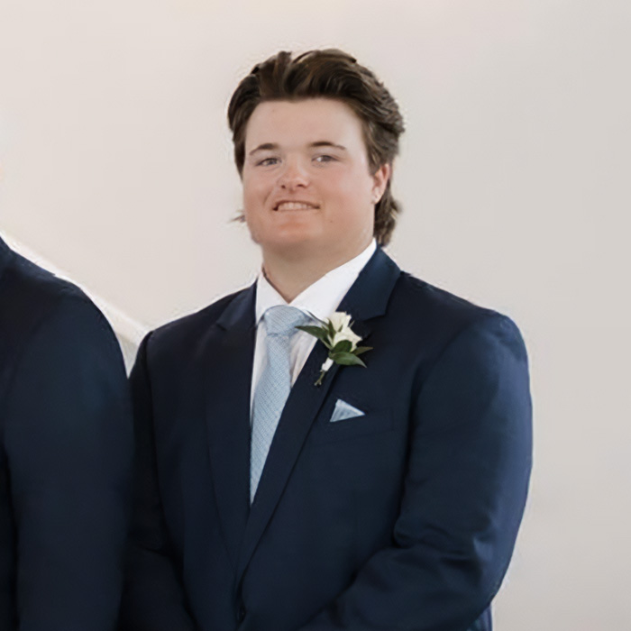Portrait of the Oklahoma teen, smiling and wearing a suit, involved in the prison sentence case.