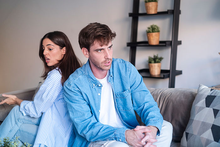 A wife arguing with her hubby, who is ignoring her questions, illustrating marital conflict. A wife arguing with her hubby, who is ignoring her questions, illustrating marital conflict.