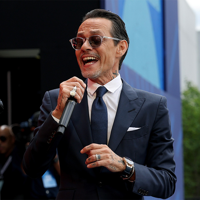 Marc Anthony performing, smiling, holding a microphone. Excruciating wedding, Beckhams family shattered, crime scene morning after. Marc Anthony performing, smiling, holding a microphone. Excruciating wedding, Beckhams family shattered, crime scene morning after.