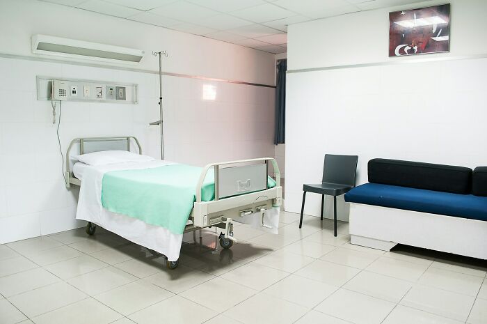 Empty hospital room, representing the threshold between life and what comes after, a place of transition.