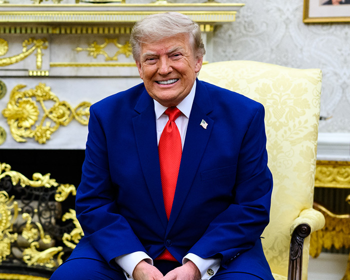 Donald Trump smiles broadly while seated in a gilded chair, sparking frenzy regarding Melania Trump's reappearance. Donald Trump smiles broadly while seated in a gilded chair, sparking frenzy regarding Melania Trump's reappearance.