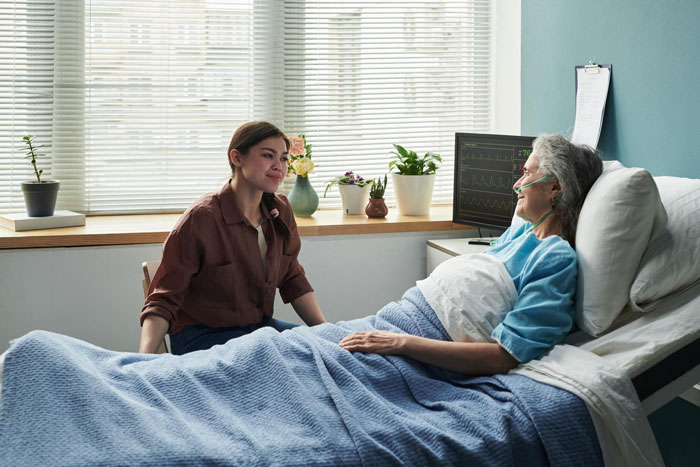 A young woman visits an elderly woman in a hospital bed, hinting at friendship ending after a bachelorette date dispute. A young woman visits an elderly woman in a hospital bed, hinting at friendship ending after a bachelorette date dispute.