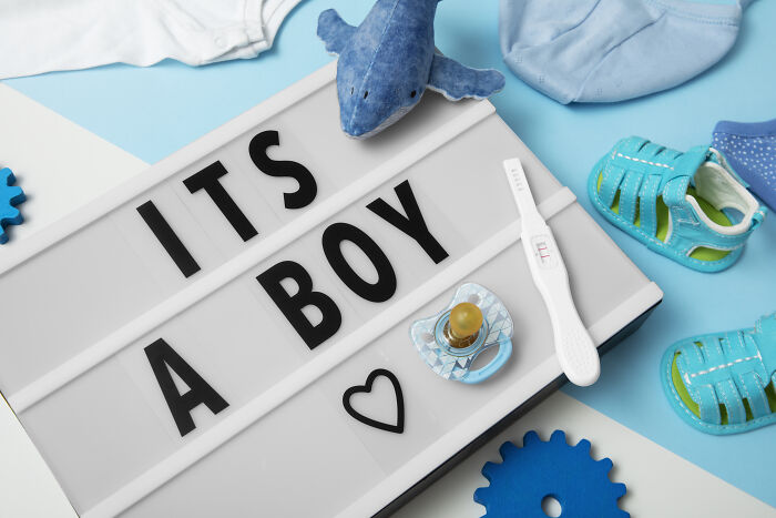 A lightbox saying ITS A BOY surrounded by baby items, related to a common name people cannot pronounce. A lightbox saying ITS A BOY surrounded by baby items, related to a common name people cannot pronounce.