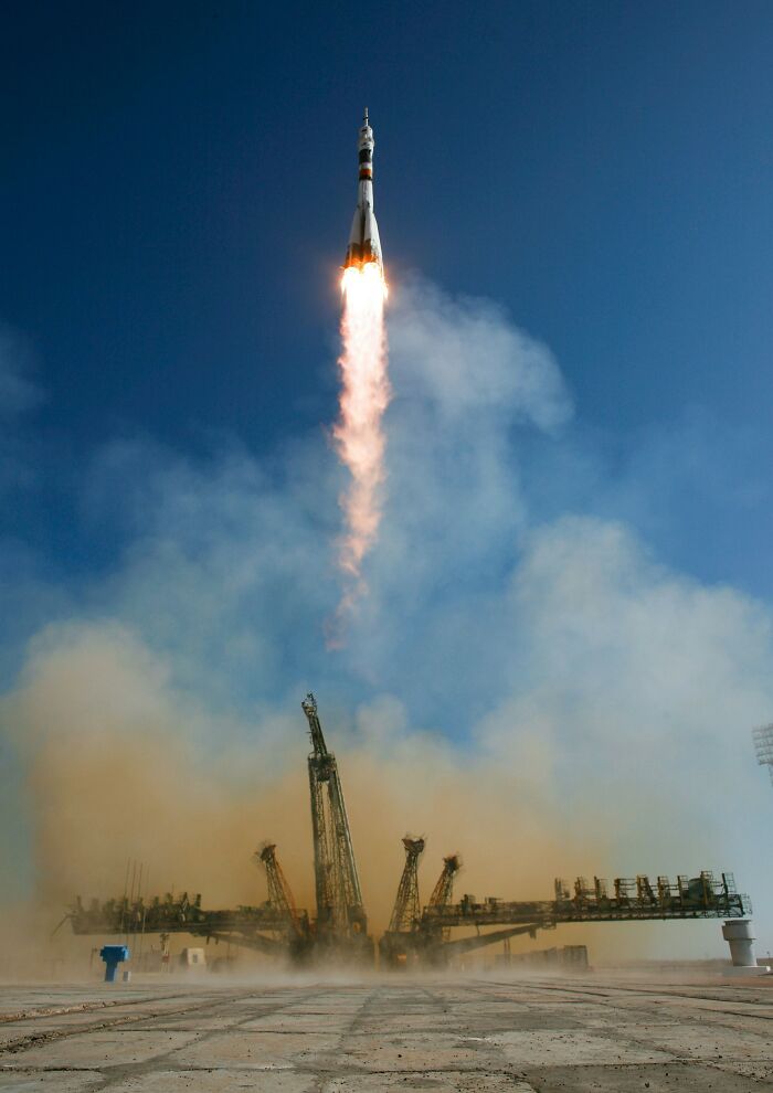 A rocket launching into a clear blue sky, showing the impressive power of scientific facts.