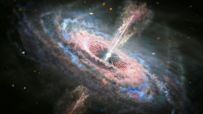 A vibrant galaxy with a central black hole emitting jets, one of many scary science facts about the universe.