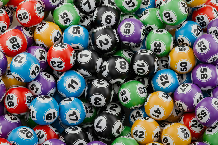 A pile of colorful lottery balls, representing the chance of a lottery winner's fortune or loss. A pile of colorful lottery balls, representing the chance of a lottery winner's fortune or loss.
