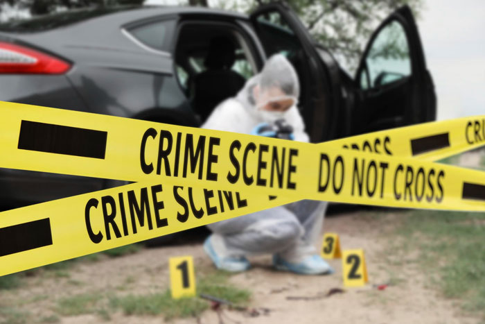 Image of a crime scene with yellow tape and forensic markers, related to eerie neighbor behavior.