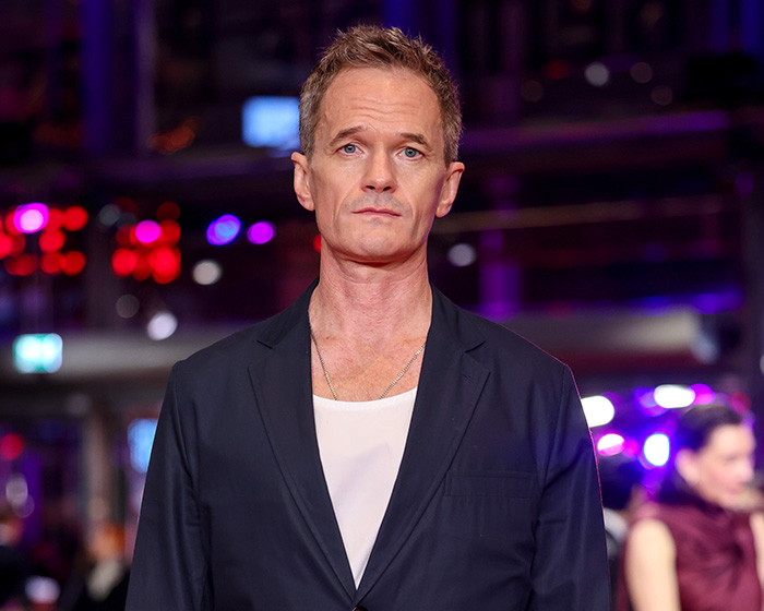 How I Met Your Mother star in a dark suit, looking serious, amidst the resurfaced controversy.