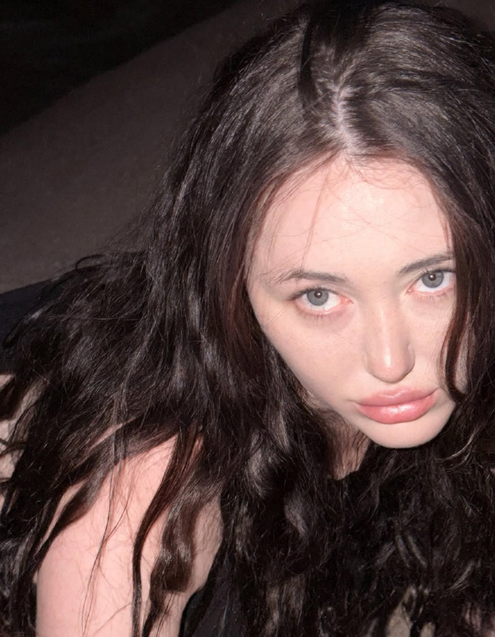 Close-up of Noah Cyrus's face during the bizarre desert photoshoot, exposing her risky look. Close-up of Noah Cyrus's face during the bizarre desert photoshoot, exposing her risky look.