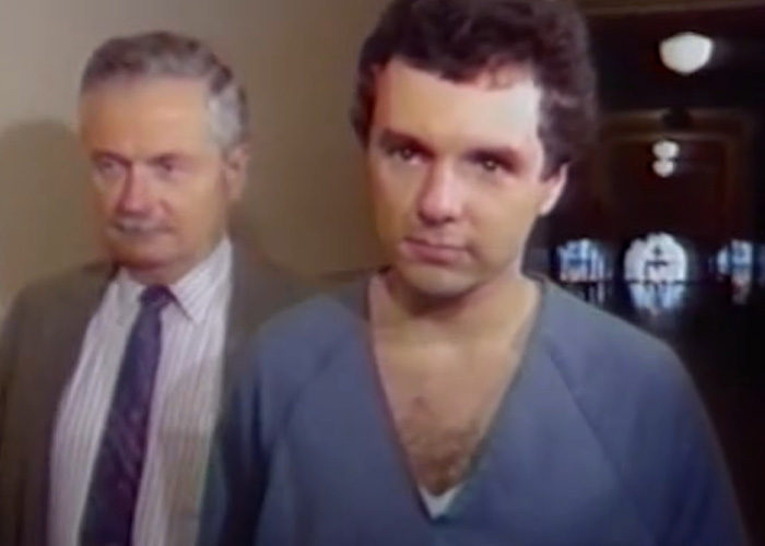 A nurse's aide, looking forward, his horrific crimes exposed, with an older man beside him. A nurse's aide, looking forward, his horrific crimes exposed, with an older man beside him.