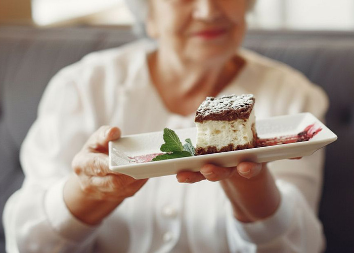 A kind nurse's aide offering cake to a patient, hiding horrific crimes for 17 years. A kind nurse's aide offering cake to a patient, hiding horrific crimes for 17 years.
