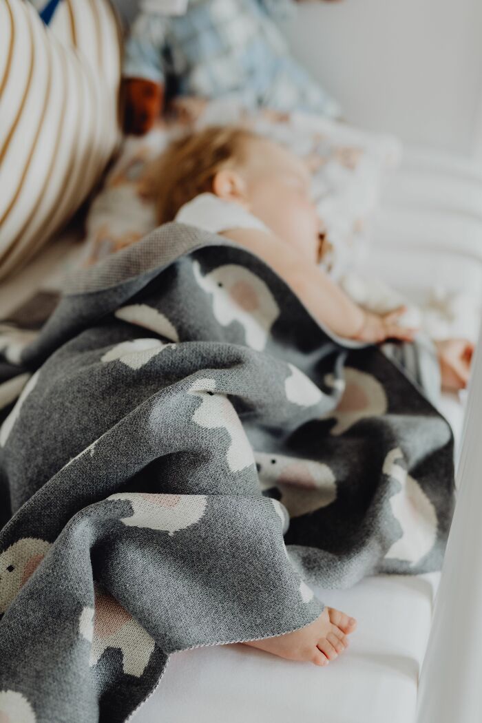 A baby sleeps peacefully, symbolizing innocence amidst painful stories of being raised by narcissists.