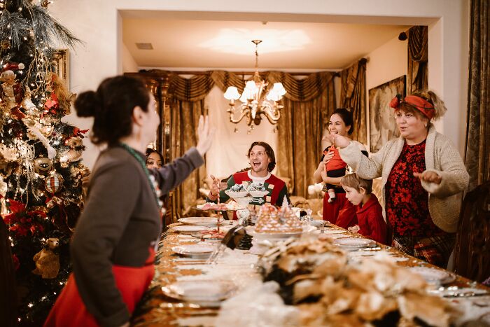A family gathered around a holiday table, with some appearing strained, highlighting the impact of being raised by narcissists.
