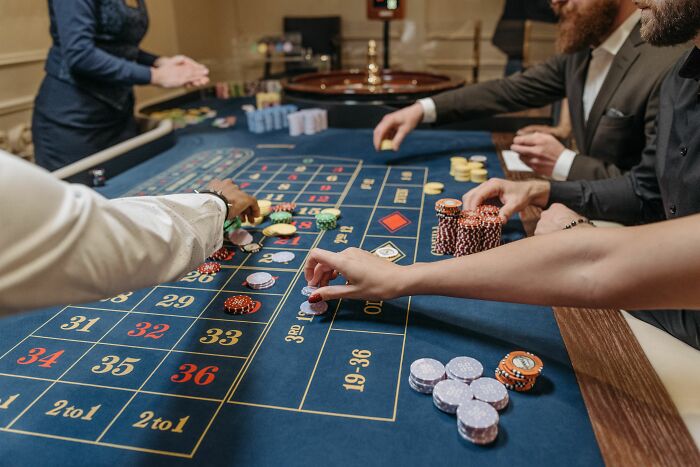 People play roulette, illustrating escapism from the pain of being raised by narcissists.