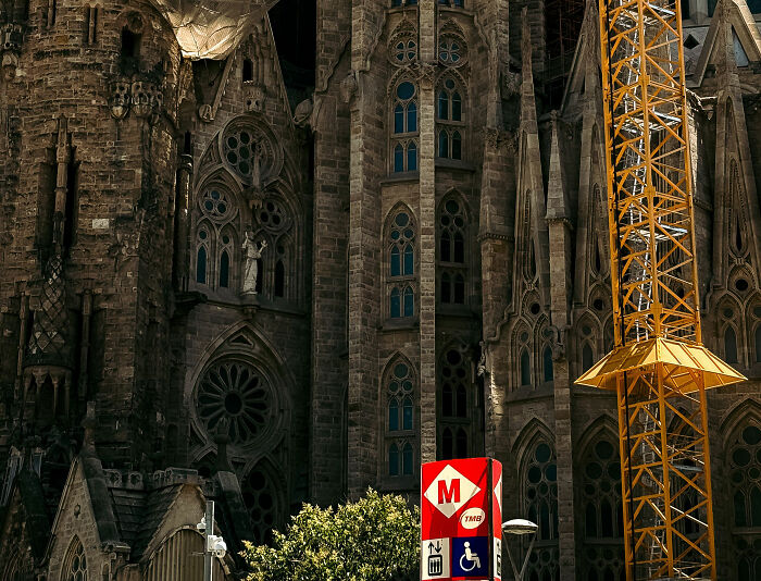 A majestic gothic building, possibly a church, with a metro station sign nearby, hinting at the metro station hero location. A majestic gothic building, possibly a church, with a metro station sign nearby, hinting at the metro station hero location.