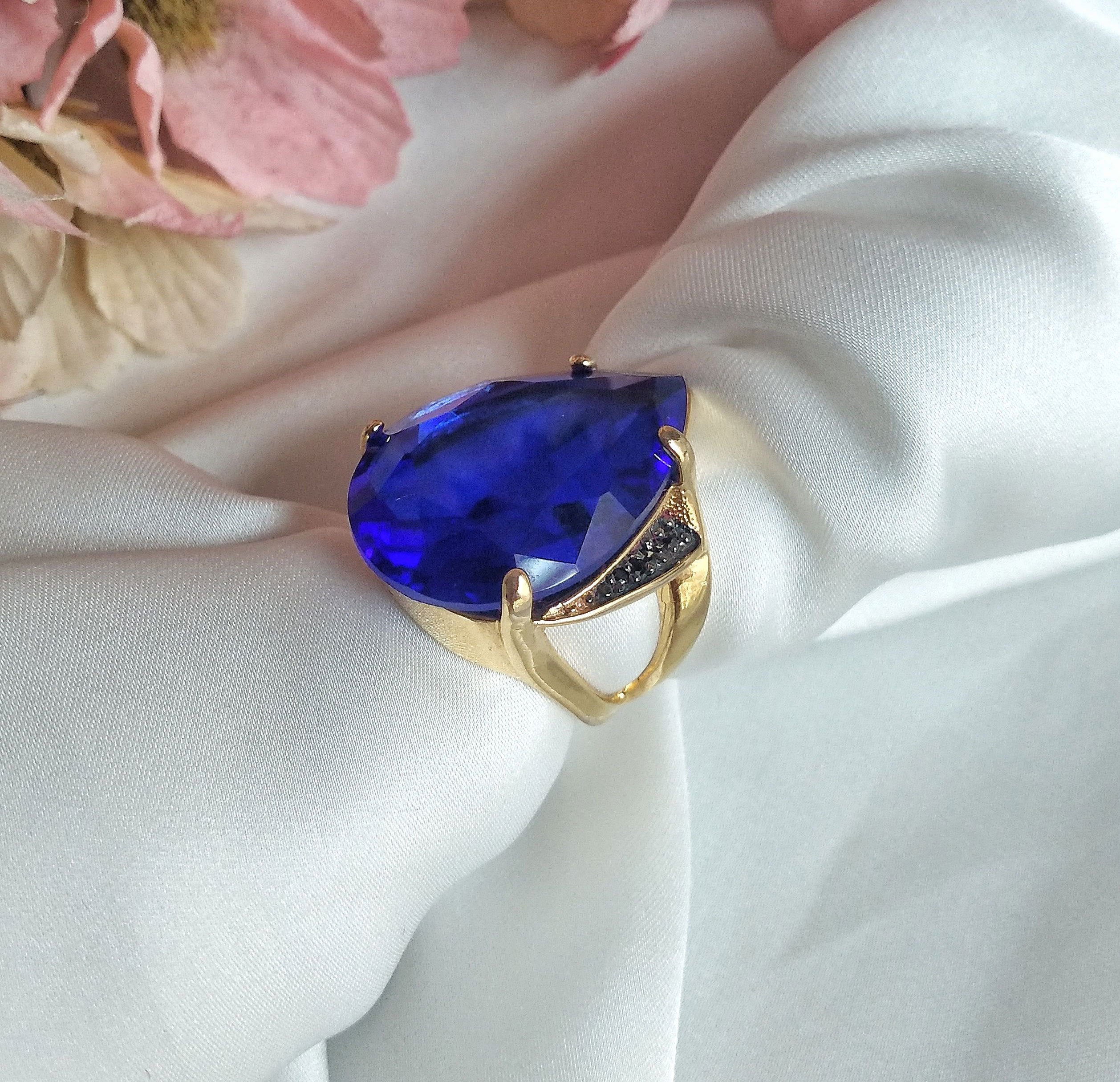 Close-up of the beautiful blue family heirloom ring that the son stole to propose. Close-up of the beautiful blue family heirloom ring that the son stole to propose.
