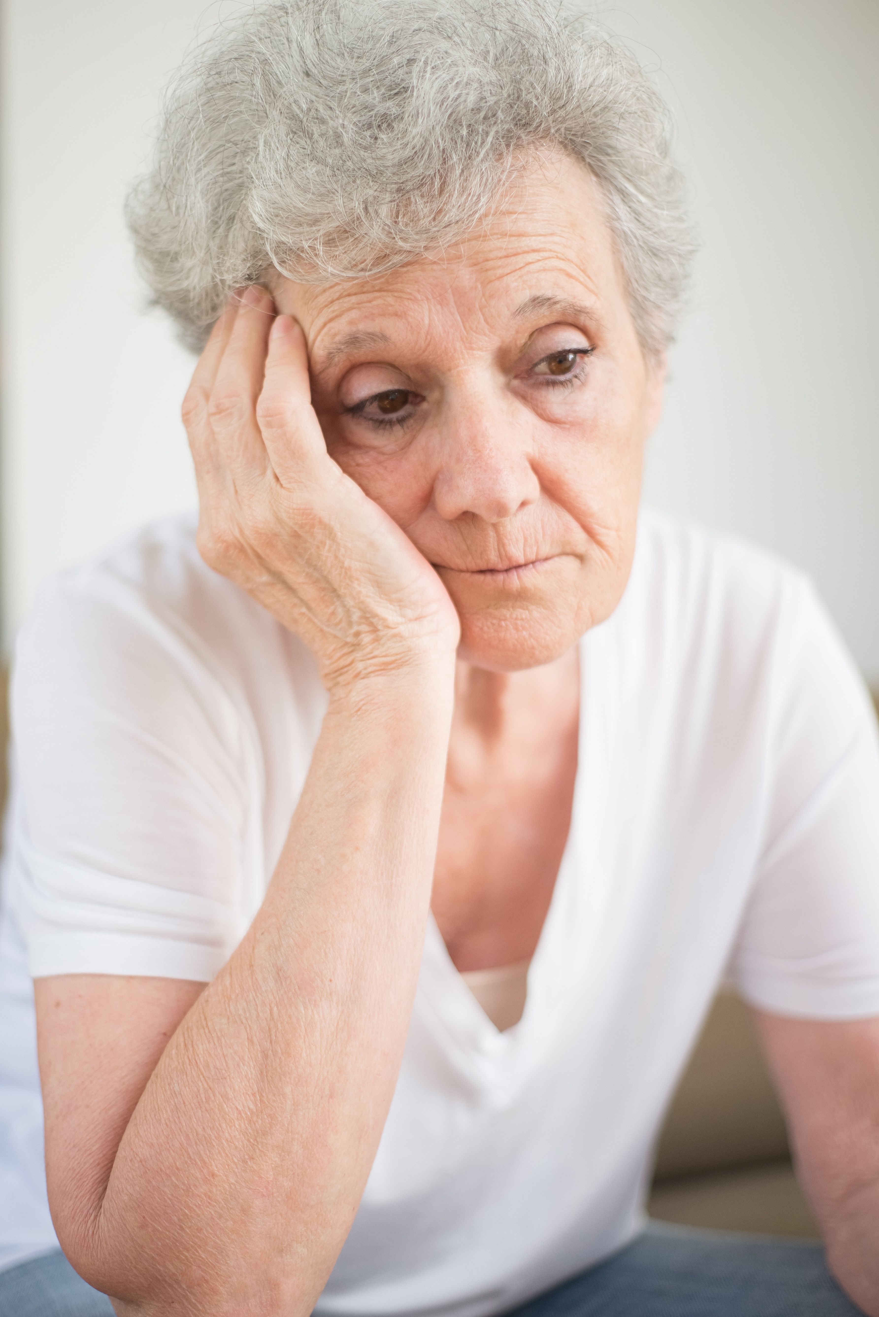 A thoughtful MIL contemplating her future after being evicted, looking for a new house. A thoughtful MIL contemplating her future after being evicted, looking for a new house.