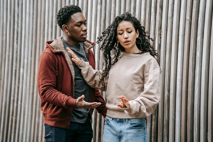 A couple arguing, highlighting relationship red flags that women swear to never ignore again for their mental health.