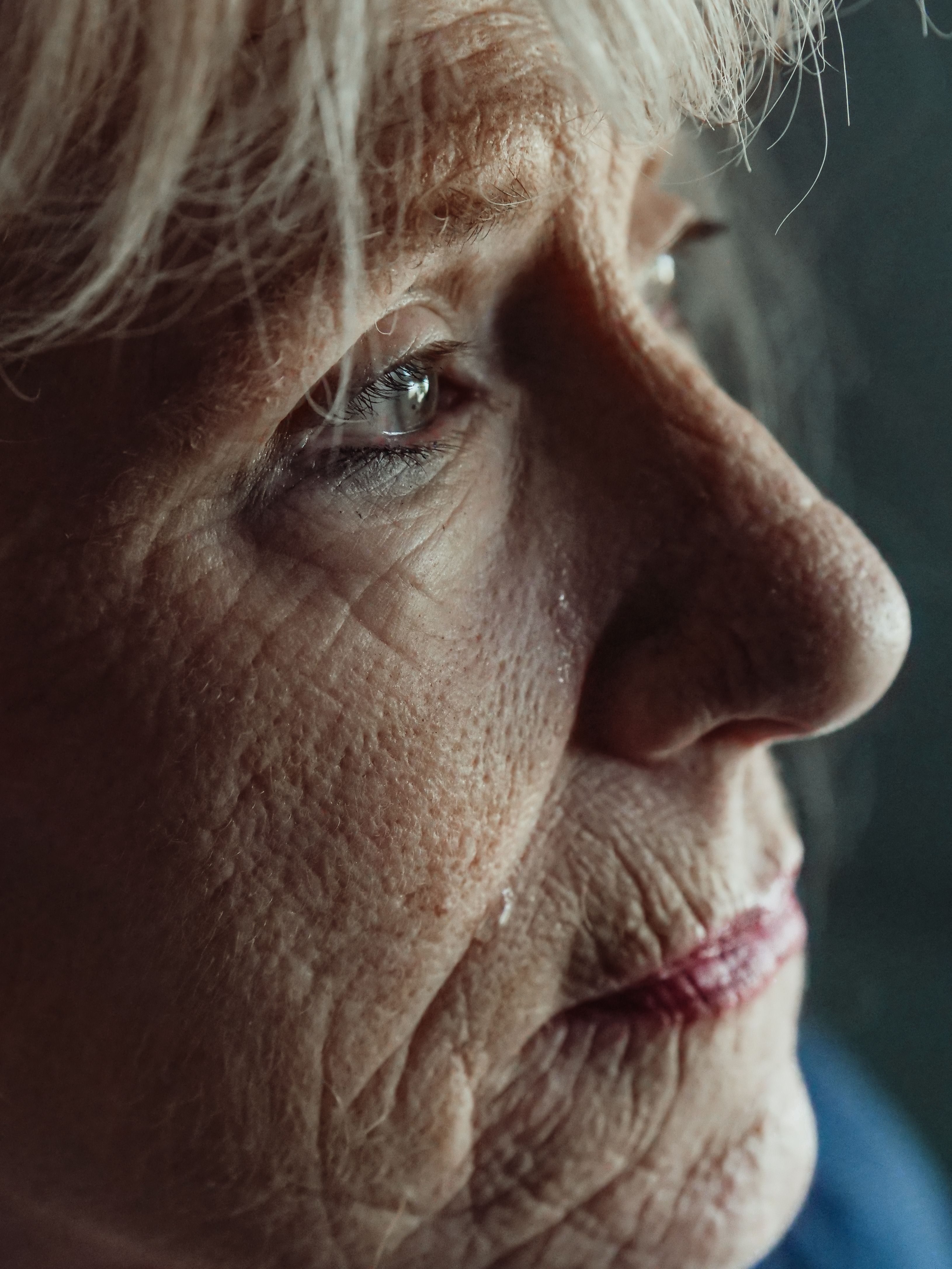 Close-up of an elderly woman's face, showing tears, reflecting the gravity of the ultimatum to her mother-in-law. Close-up of an elderly woman's face, showing tears, reflecting the gravity of the ultimatum to her mother-in-law.