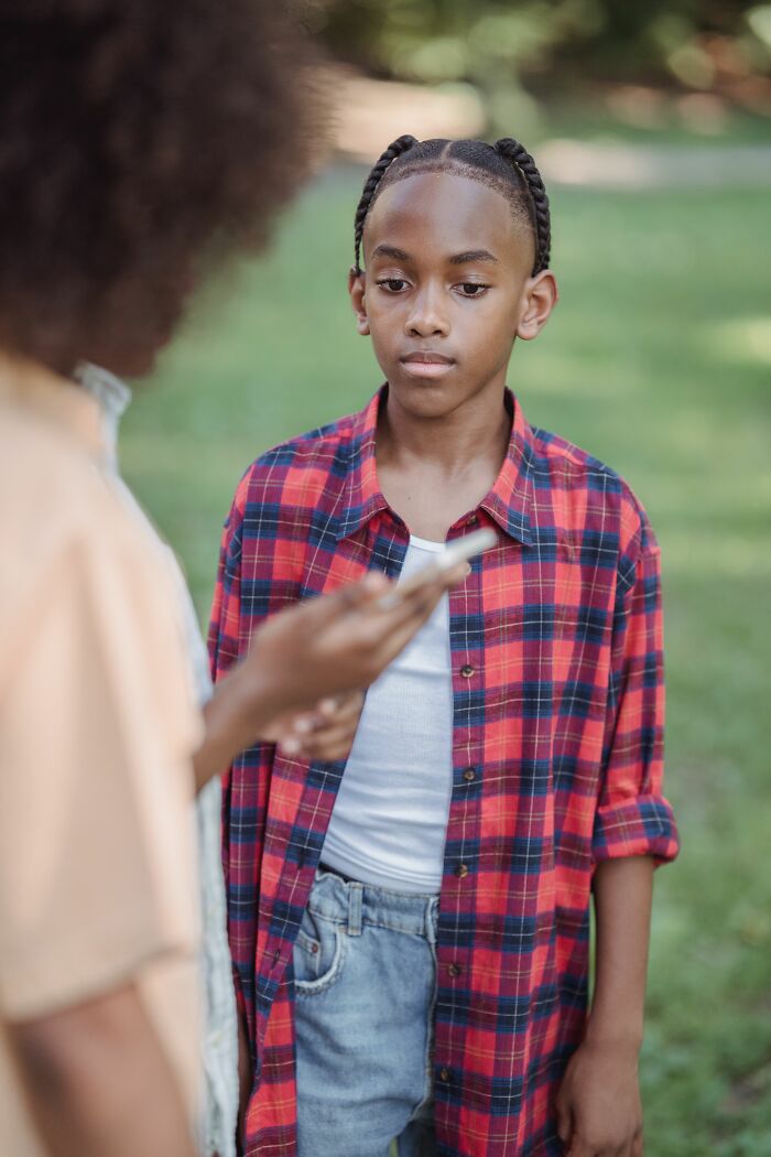 A young boy looks downcast, receiving sick burns that earn the speaker mad respect for their directness.