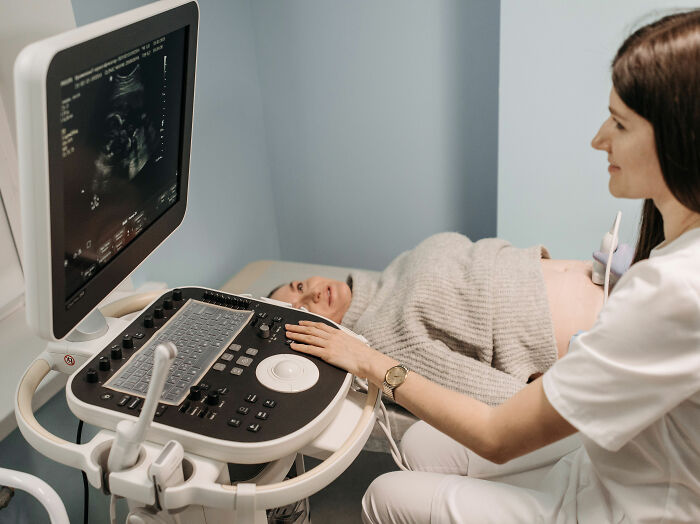 A woman undergoing an ultrasound, potentially for accidental married cousin advice. A woman undergoing an ultrasound, potentially for accidental married cousin advice.