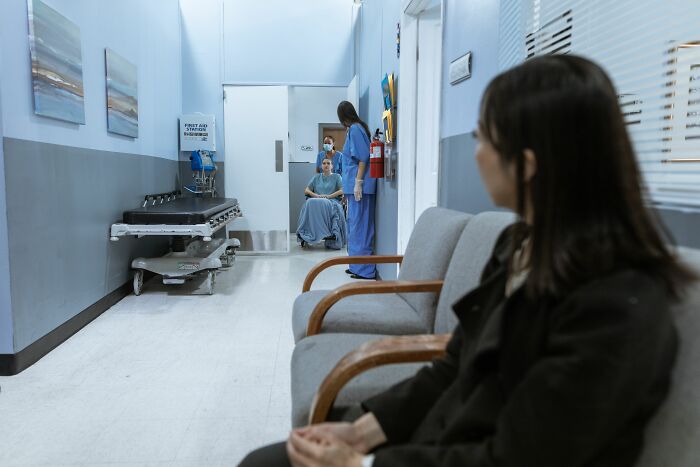 A woman sits in a waiting room, reflecting on common misconceptions that people believe today.