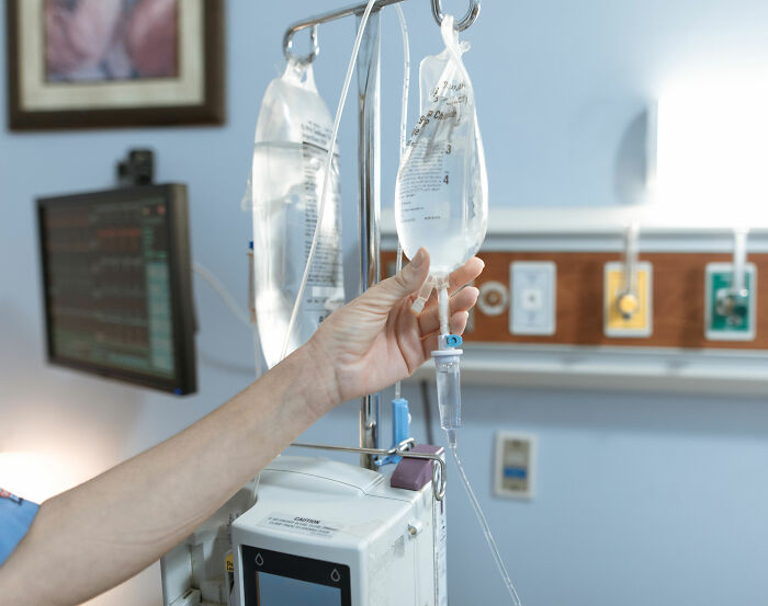 A hospital room with an IV drip, related to Christina Applegate's health battle update. A hospital room with an IV drip, related to Christina Applegate's health battle update.