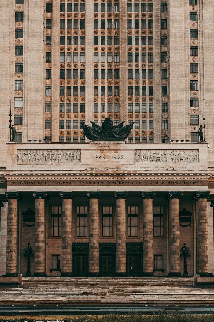 The grand facade of a historic building, showing intricate architectural details. People believe today that propaganda influences beliefs.