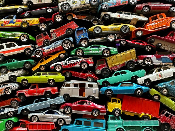 A collection of colorful toy cars, symbolizing the diverse stories of people who crossed the line between life and what comes after.