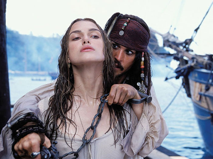 Johnny Depp as Jack Sparrow holding Keira Knightley as Elizabeth Swann with a chain, relevant to Margot Robbie controversy. Johnny Depp as Jack Sparrow holding Keira Knightley as Elizabeth Swann with a chain, relevant to Margot Robbie controversy.