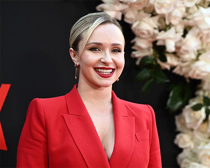 Hayden Panettiere smiling in a red blazer, with 911 dispatch audio revealing possible cause of passing. Hayden Panettiere smiling in a red blazer, with 911 dispatch audio revealing possible cause of passing.
