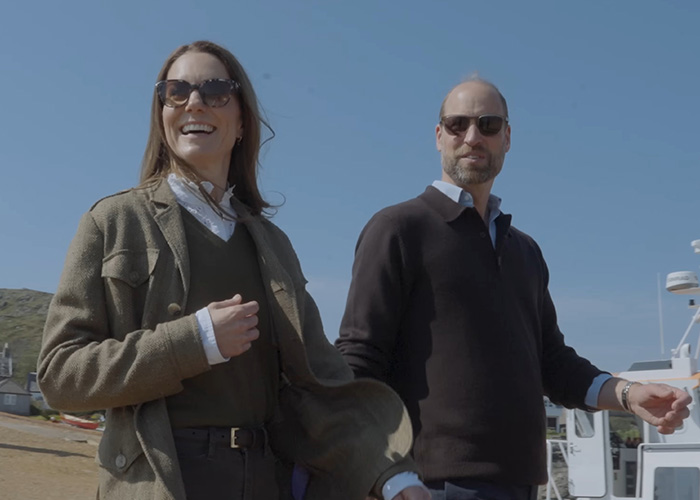 Prince William and Kate Middleton smiling and walking outdoors, both wearing sunglasses. King Charles, Queen Camilla.