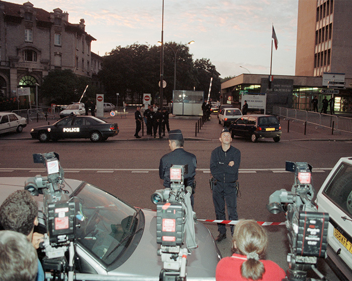 Police and media at a scene related to Princess Diana, fueling royal conspiracy theory discussions. Police and media at a scene related to Princess Diana, fueling royal conspiracy theory discussions.