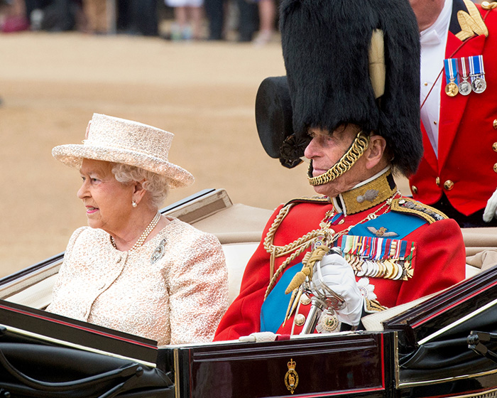 Queen Elizabeth II and Prince Philip in a carriage, hinting at the royal family's involvement in a conspiracy theory. Queen Elizabeth II and Prince Philip in a carriage, hinting at the royal family's involvement in a conspiracy theory.