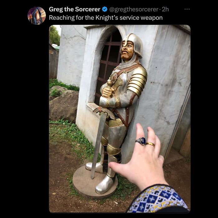 A hand reaching for a knight statue's sword, an example of hilarious memes for procrastinating.