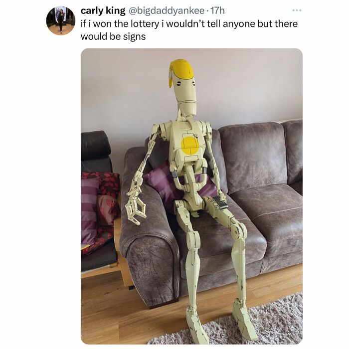 A screenshot of a tweet by carly king about winning the lottery, featuring a robot on a couch, perfect for hilarious memes while procrastinating.
