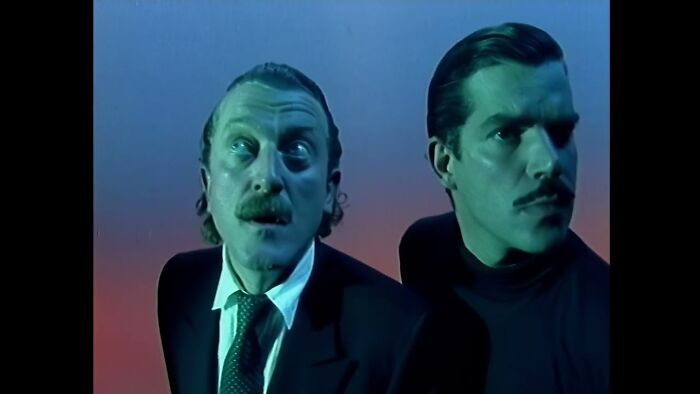 Two men with expressive faces looking up, representing the surprising ways people get rich.