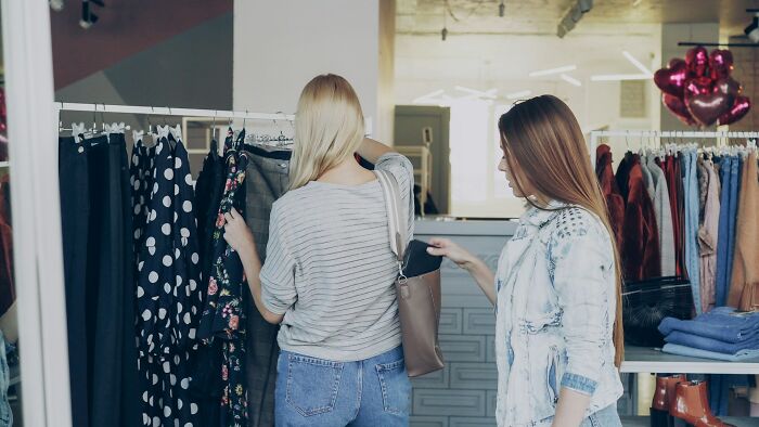 Two women shopping, depicting a friendship that fell apart after years of being close.