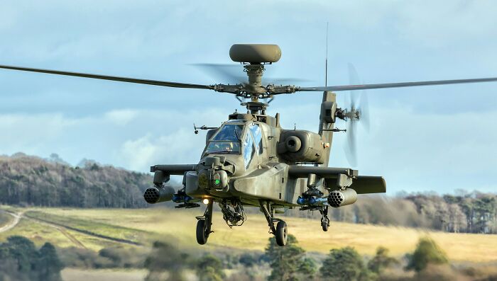 An Apache helicopter hovers over a field. Wildest moments for people who worked for the rich.