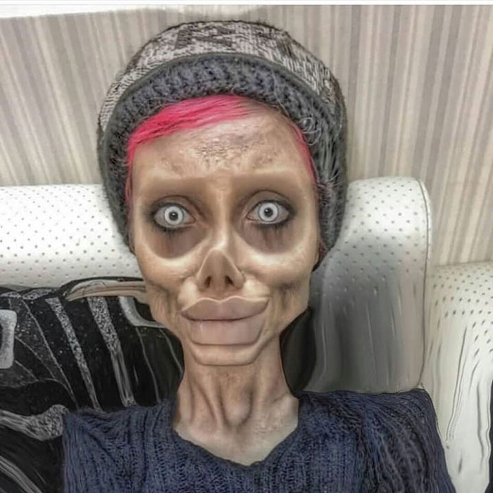Iranian woman, the Zombie Angelina Jolie, with pink hair and exaggerated features, showcasing an illusion of her appearance.