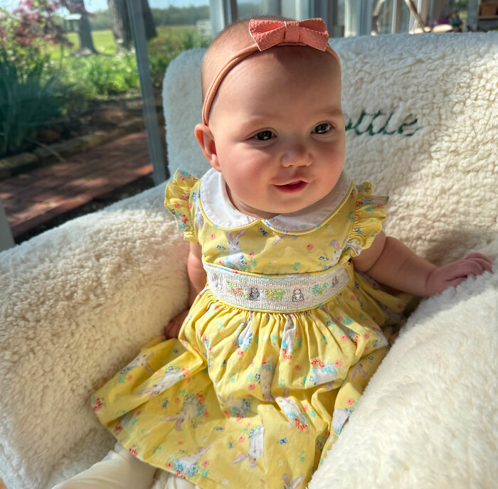 A baby granddaughter in a yellow dress with a pink bow headband, looking at the camera. The doctor left her in a hot car. A baby granddaughter in a yellow dress with a pink bow headband, looking at the camera. The doctor left her in a hot car.