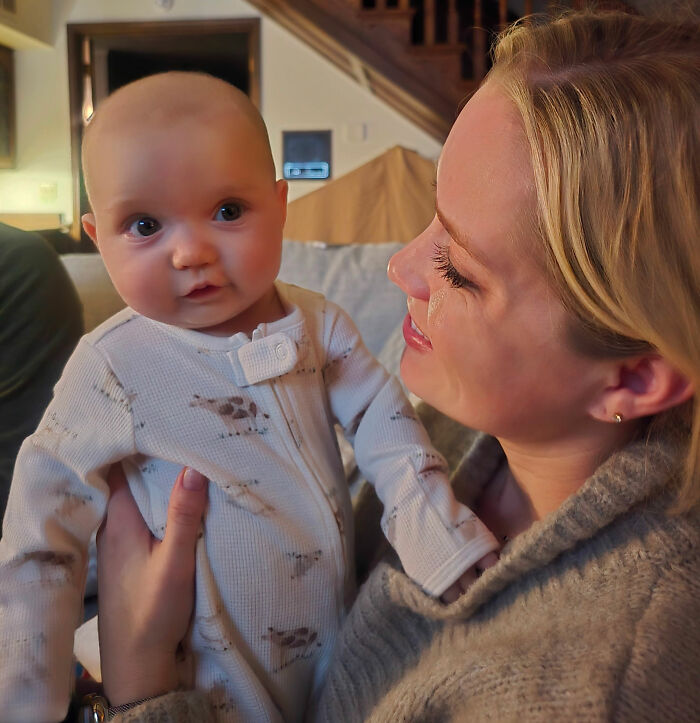 A woman holding a baby granddaughter, illustrating the family aspect of the hot car incident with the doctor. A woman holding a baby granddaughter, illustrating the family aspect of the hot car incident with the doctor.