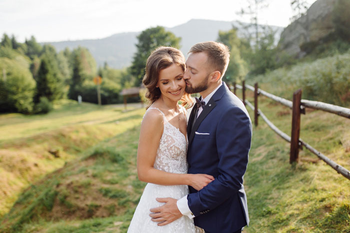 A happy couple embracing at their wedding, celebrating peacefully after the sister-in-law was banned. A happy couple embracing at their wedding, celebrating peacefully after the sister-in-law was banned.