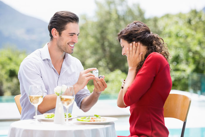 A happy couple having a romantic meal, the man proposing to his bride. A happy couple having a romantic meal, the man proposing to his bride.