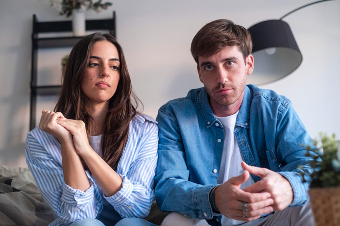 A couple looking serious, possibly discussing the wedding ban for the SIL after bullying a deaf cousin. A couple looking serious, possibly discussing the wedding ban for the SIL after bullying a deaf cousin.