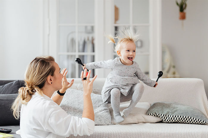 A woman helps her sister have a baby, playing with a child joyfully on a couch, keeping the truth secret. A woman helps her sister have a baby, playing with a child joyfully on a couch, keeping the truth secret.