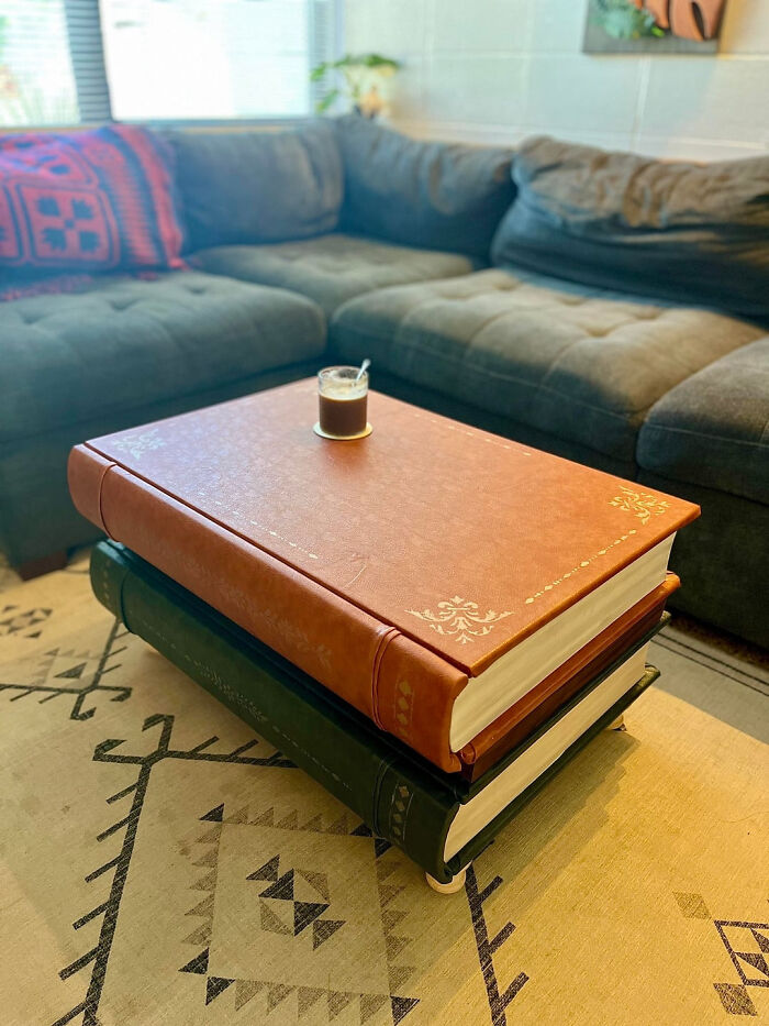 A DIY home project of a large coffee table made from two faux books, proving you dont need a huge budget.