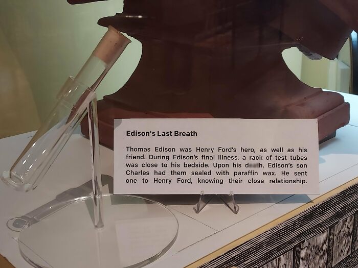 A test tube display with a plaque about Edison's Last Breath, a fascinating photo from American history.